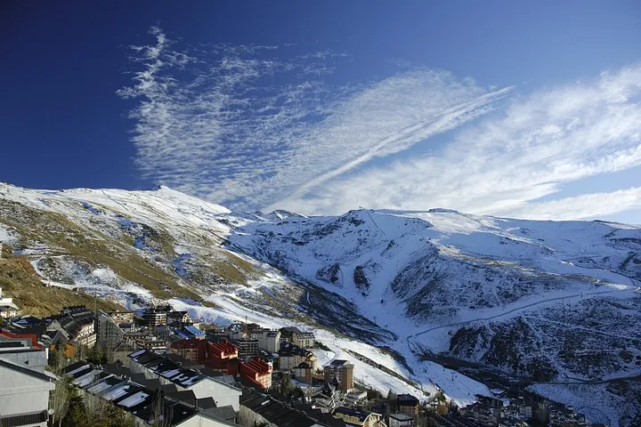 A ski resort village nestled at the base of snow-covered mountains